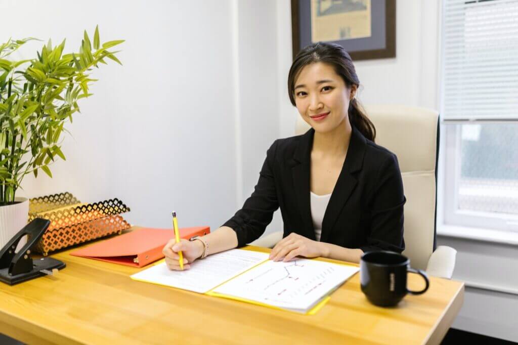 Young businessperson sitting at a desk